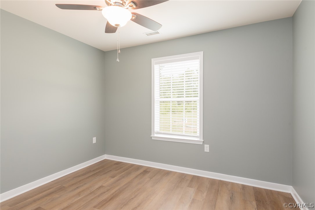 2070 Genito Road Moseley, VA 23120 - Photo 15 of 44 an empty room with a window and a fan