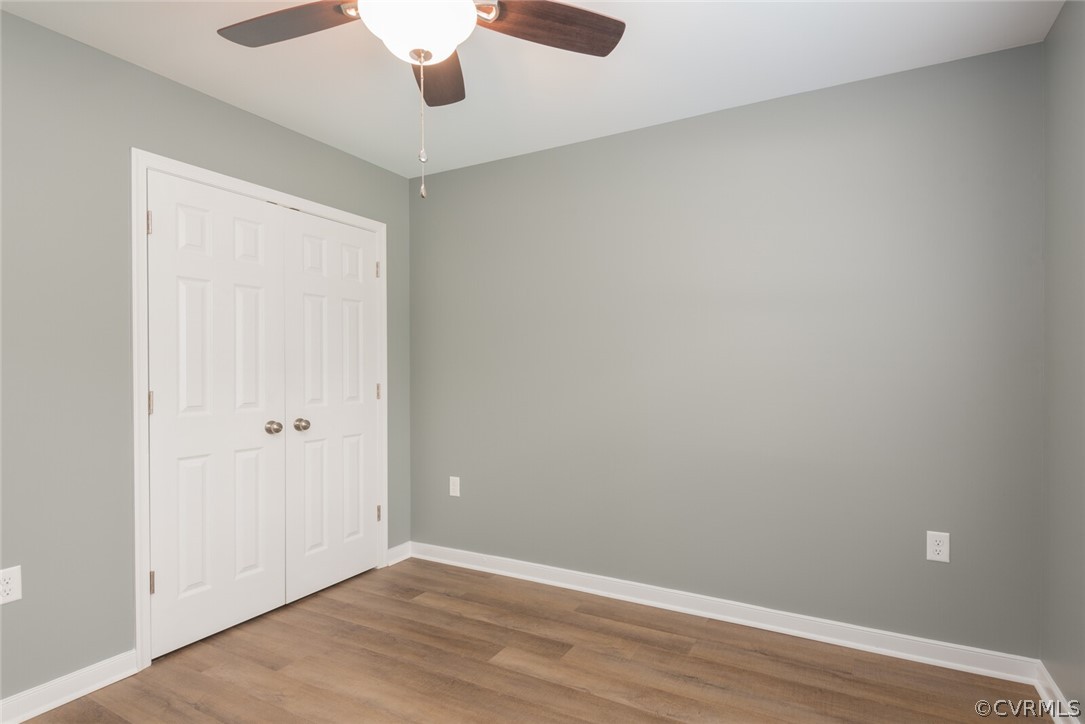 2070 Genito Road Moseley, VA 23120 - Photo 17 of 44 a view of an empty room with wooden floor