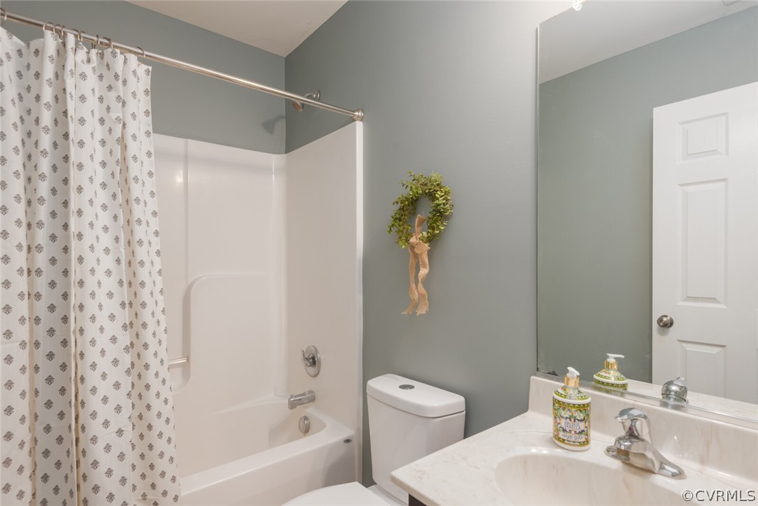2070 Genito Road Moseley, VA 23120 - Photo 18 of 44 a bathroom with a sink toilet and bathtub