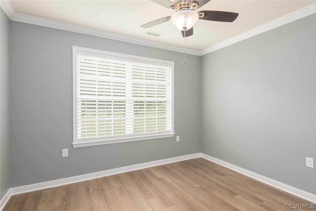 2070 Genito Road Moseley, VA 23120 - Photo 19 of 44 a view of an empty room with a window and a chandelier fan