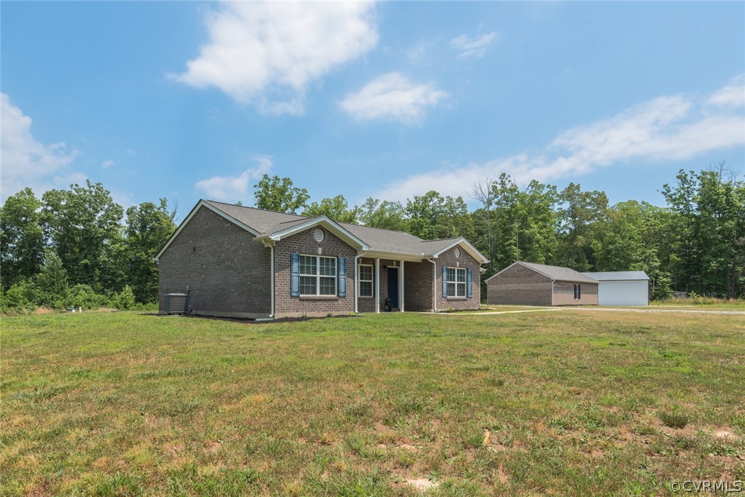 2070 Genito Road Moseley, VA 23120 - Photo 38 of 44 a white house with a big yard and large tree