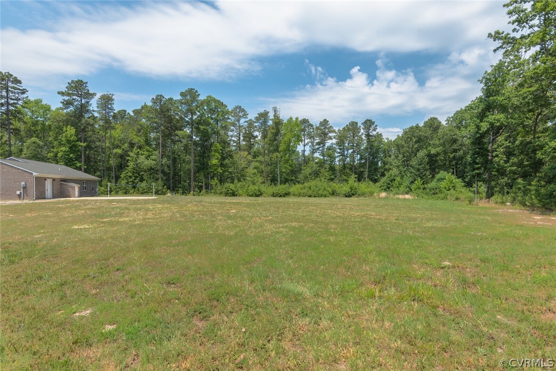 2070 Genito Road Moseley, VA 23120 - Photo 44 of 44 a view of a field with an trees in the background