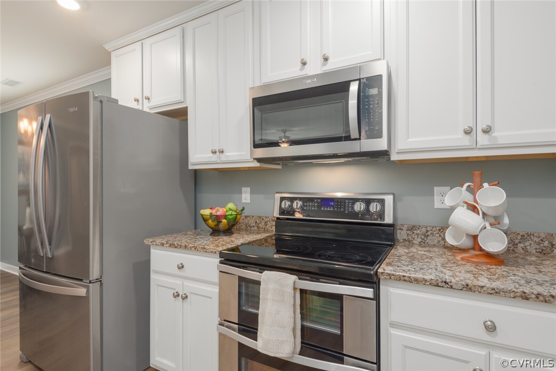 2070 Genito Road Moseley, VA 23120 - Photo 8 of 44 a kitchen with stainless steel appliances granite countertop a refrigerator stove and white cabinets