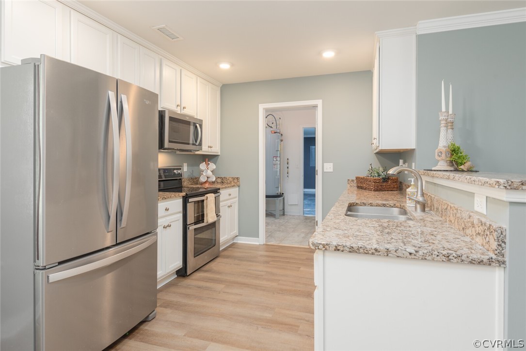 2070 Genito Road Moseley, VA 23120 - Photo 9 of 44 a kitchen with granite countertop a refrigerator and a sink