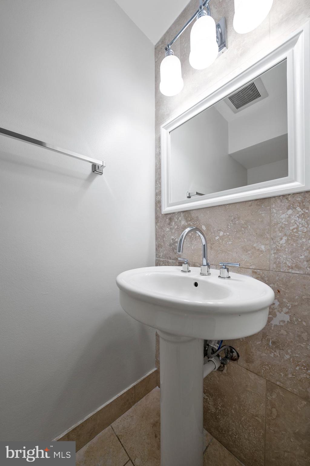 2346 Southgate Square Reston, VA 20191 - Photo 14 of 43 Powder bathroom off front entry hall