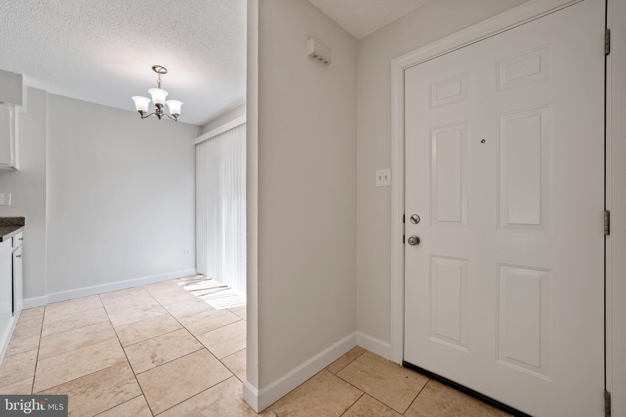 2346 Southgate Square Reston, VA 20191 - Photo 5 of 43 Foyer view into dining area