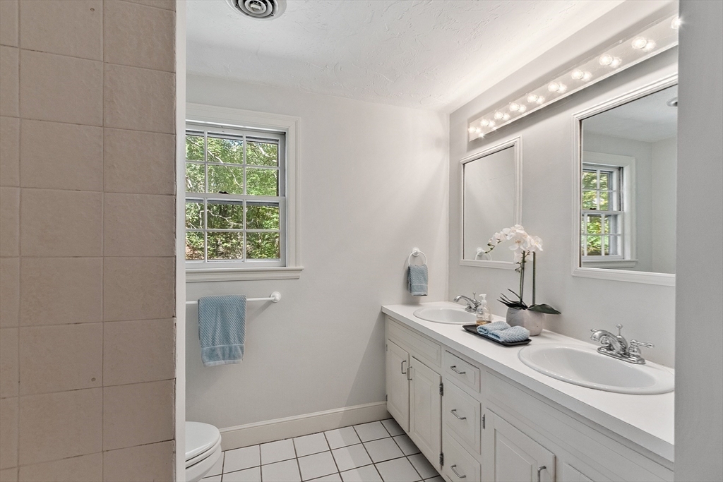 2 Partridge Hill Road Dover, MA 02030 - Photo 25 of 31 a bathroom with a sink a vanity and a mirror