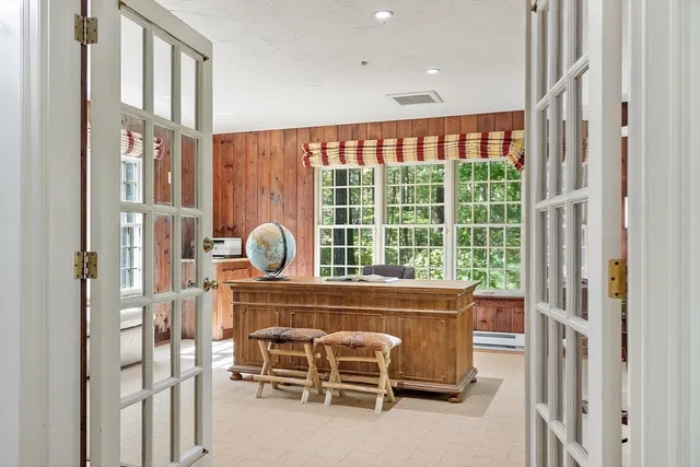 a view of a workspace with furniture and a gate
