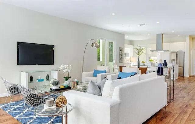 a living room with furniture fireplace and a flat screen tv