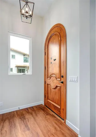 a view of front door with wooden floor
