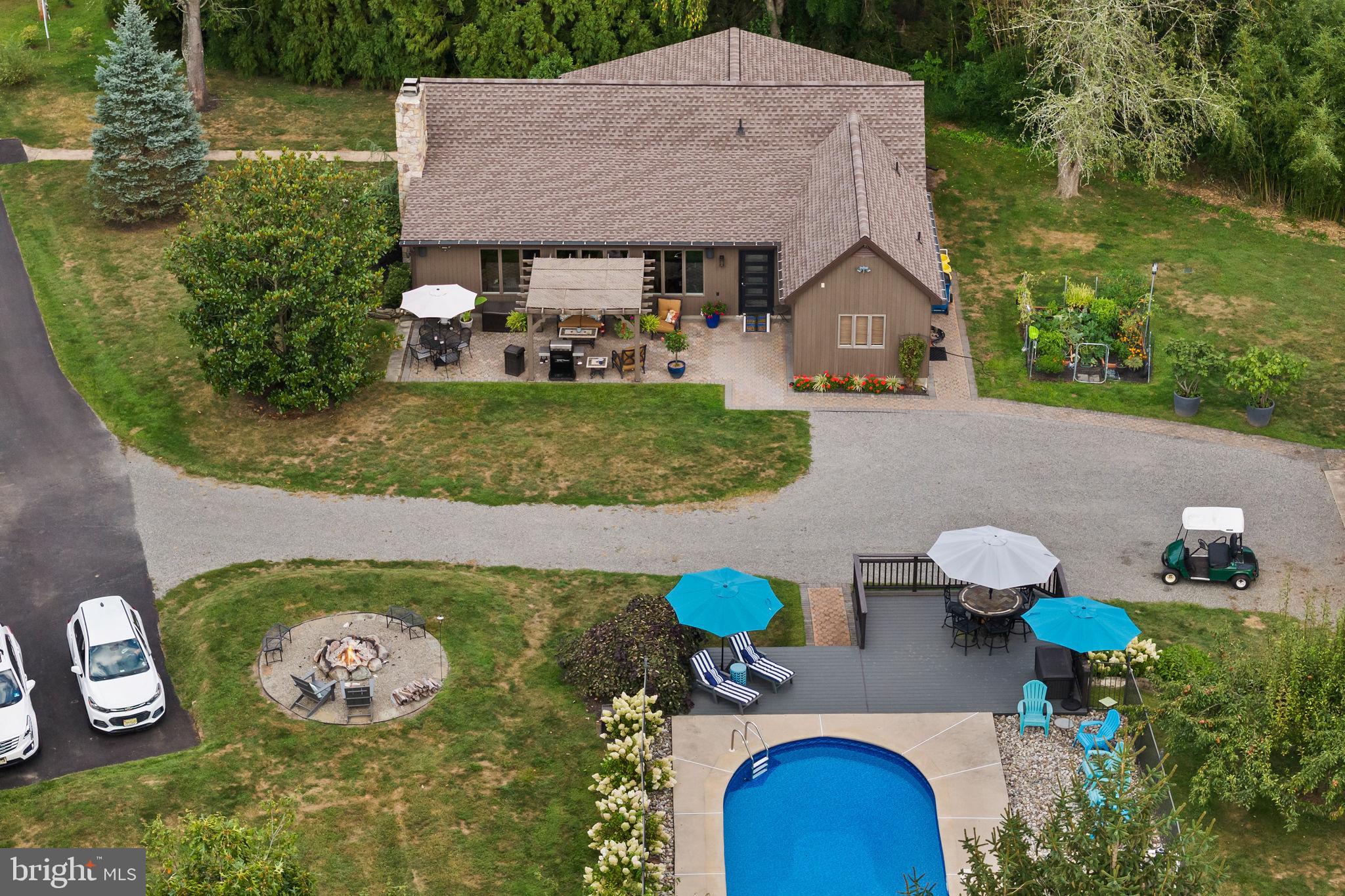 409 Federal City Road Pennington, NJ 08534 - Photo 12 of 54 a aerial view of a house with table and chairs potted plants