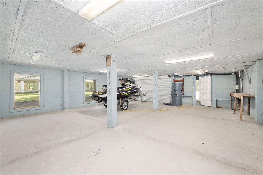 7870 Southwest 25th Place Bell, FL 32619 - Photo 98 of 99 a view of a room with gym equipment and a window
