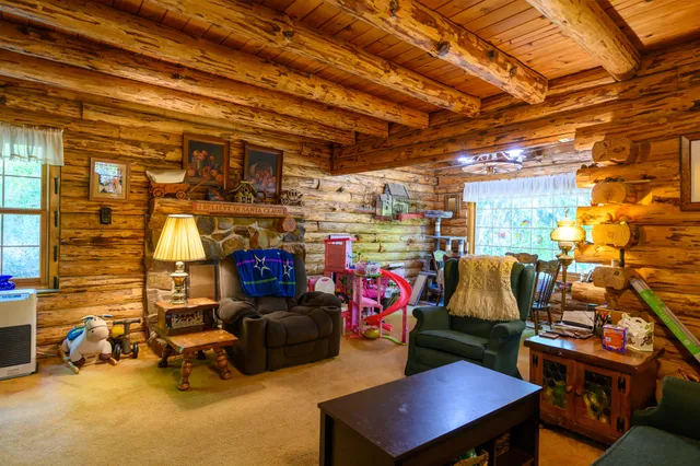 a view of a dining room with furniture window and outside view