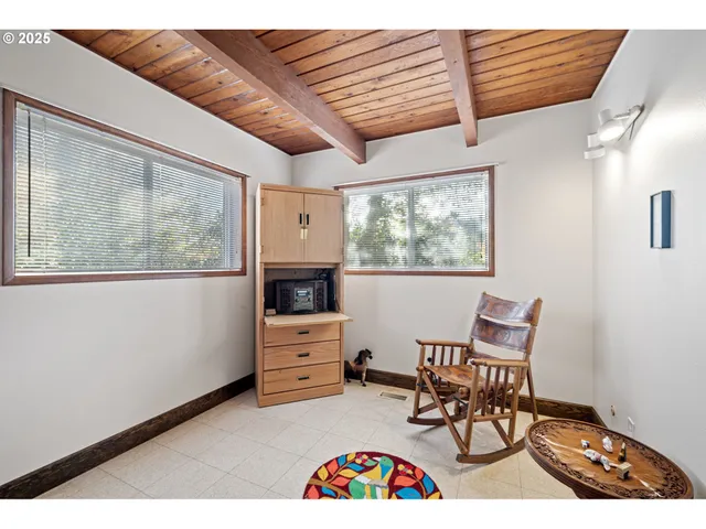 a bedroom with furniture and a window
