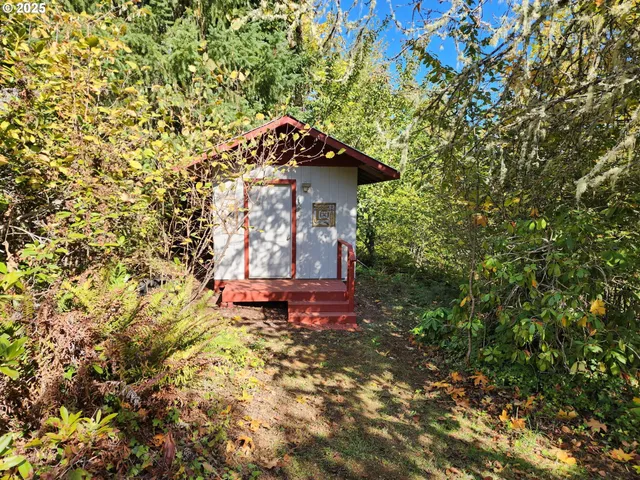 a table and a fire pit next to a yard