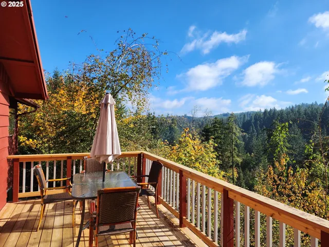a view of a balcony with chairs