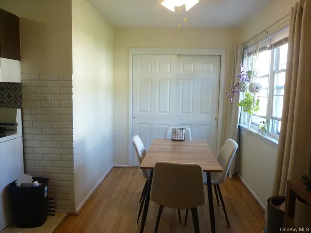 a view of a dining room that has a table and chairs in it