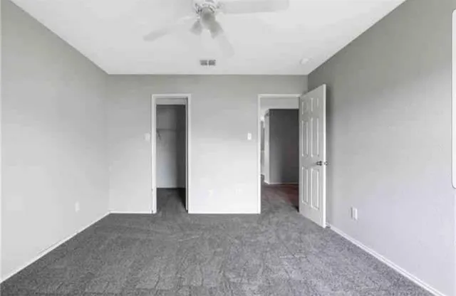 a view of an empty room with a bathroom