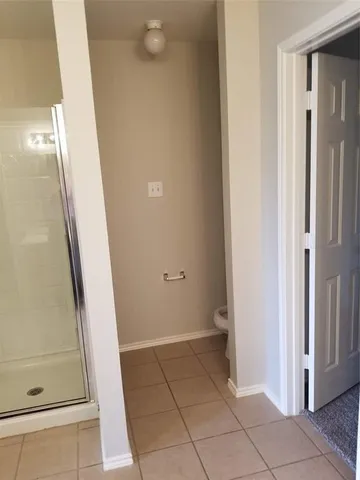 a view of a bathroom with a sink and a shower