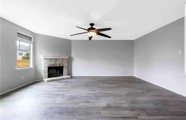 a view of empty room with fireplace