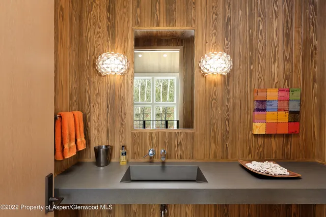 a dining room with furniture and chandelier