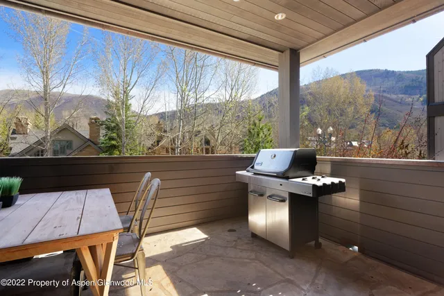 a view of balcony with furniture