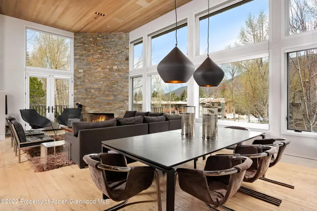 a view of a dining room with furniture window and outside view