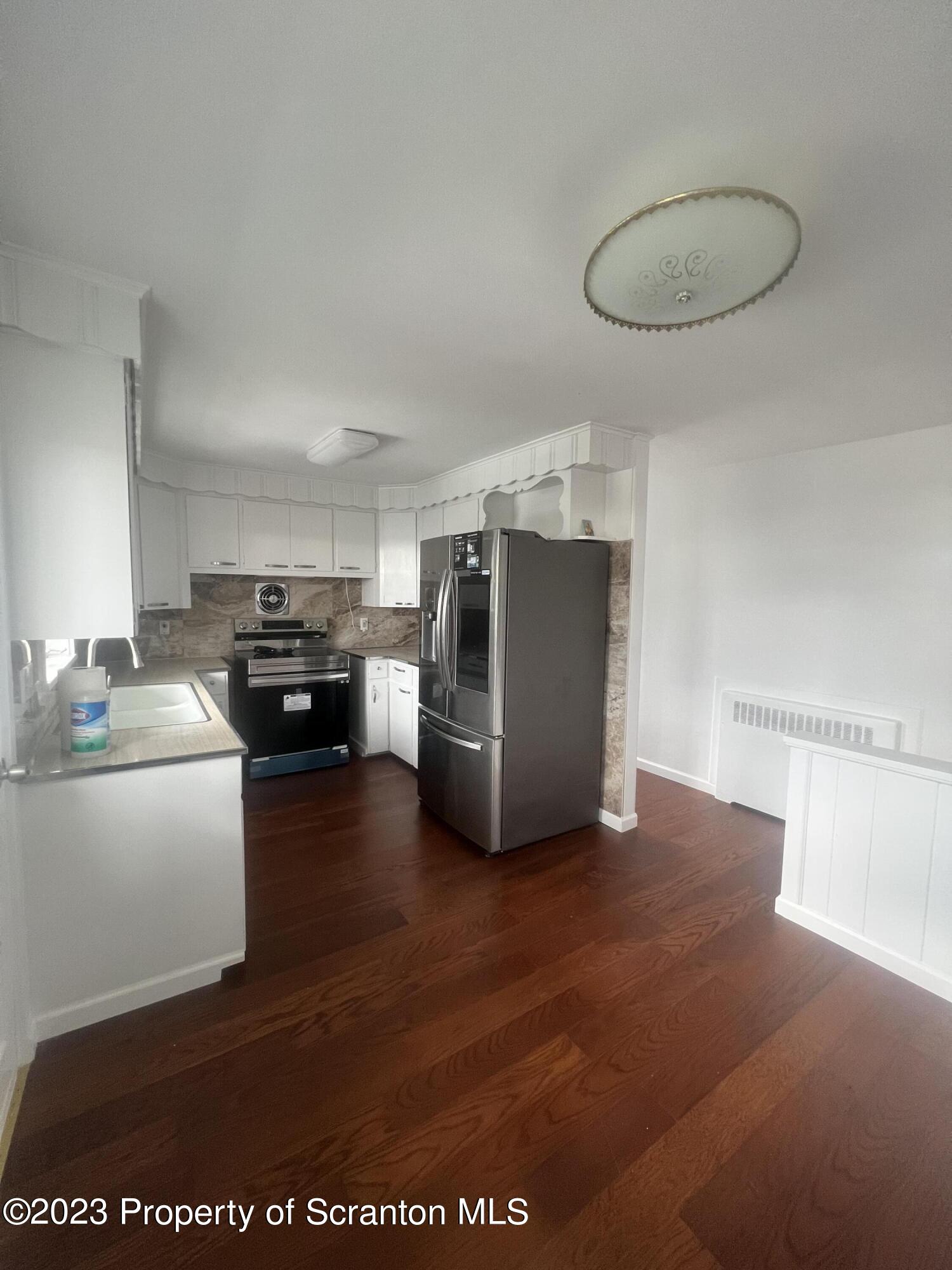 1151 Amherst Street Scranton, PA 18504 - Photo 5 of 11 a living room with furniture and a table
