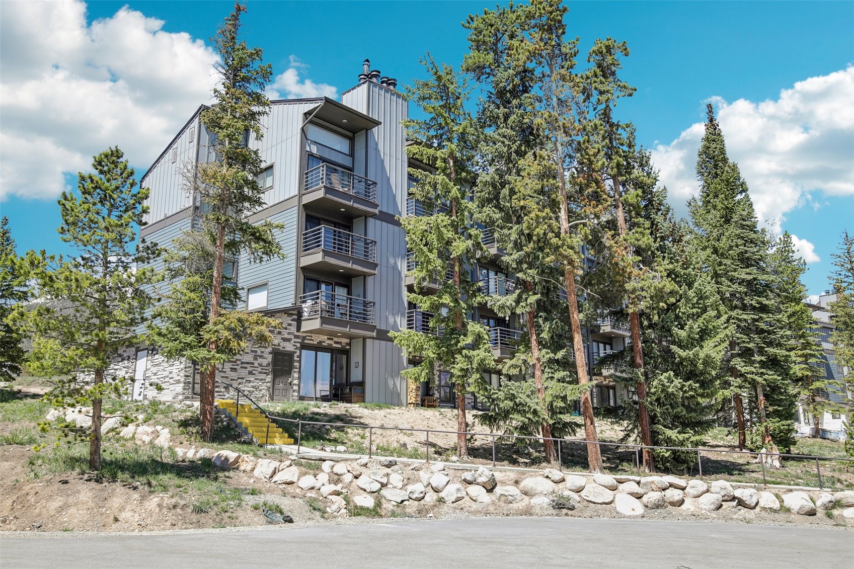 89310 Ryan Gulch Road, Unit 103 Silverthorne, CO 80498 - Photo 24 of 48 a front view of a house with a yard