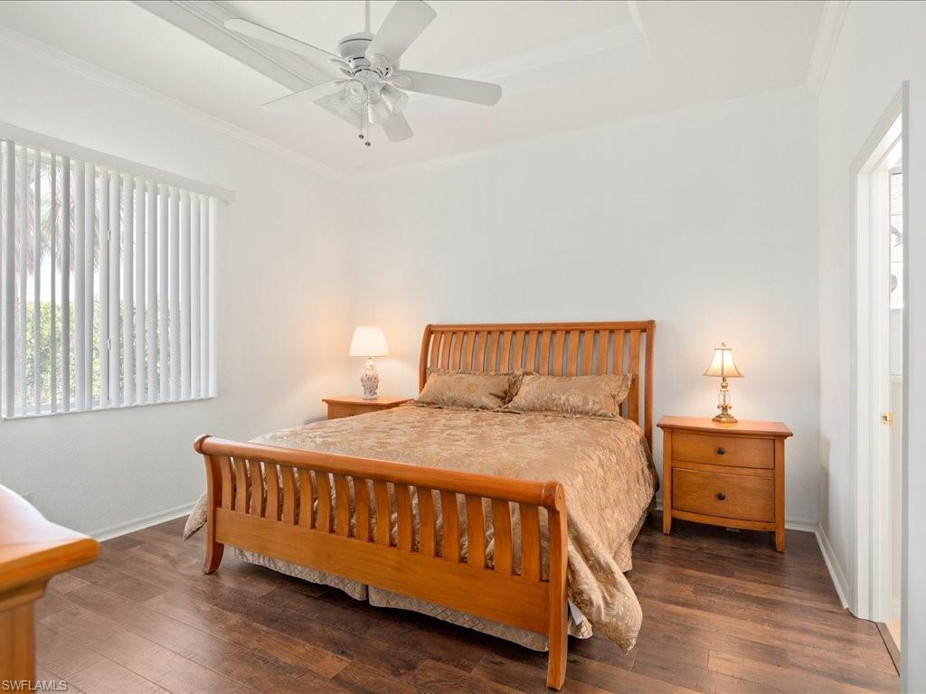 8679 Spring Mountain Way Fort Myers, FL 33908 - Photo 11 of 21 a bedroom with a bed and window