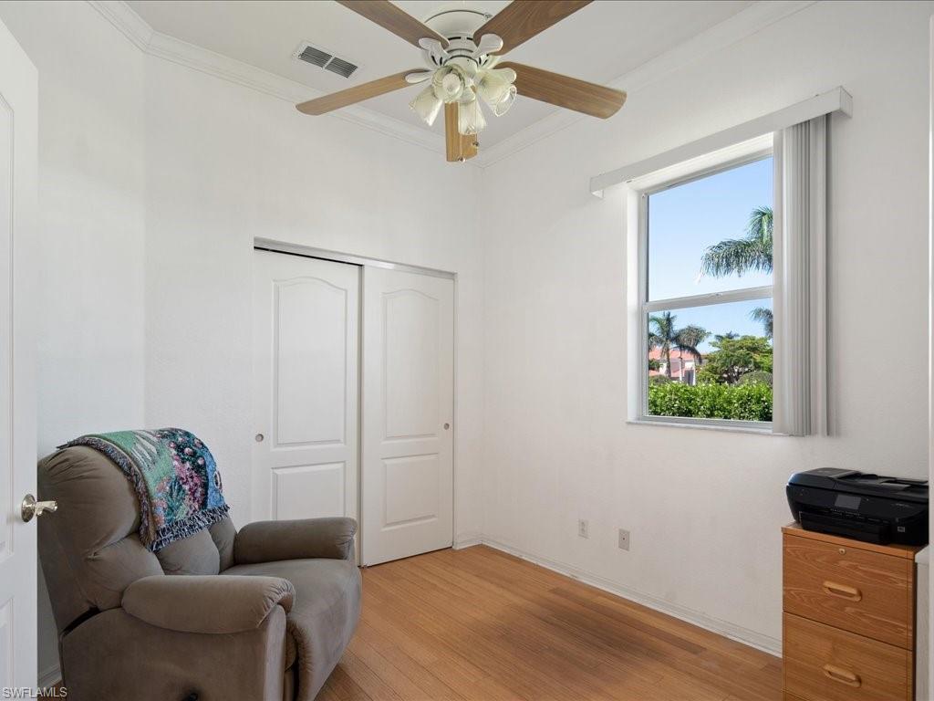 8679 Spring Mountain Way Fort Myers, FL 33908 - Photo 18 of 21 a living room with furniture and a window