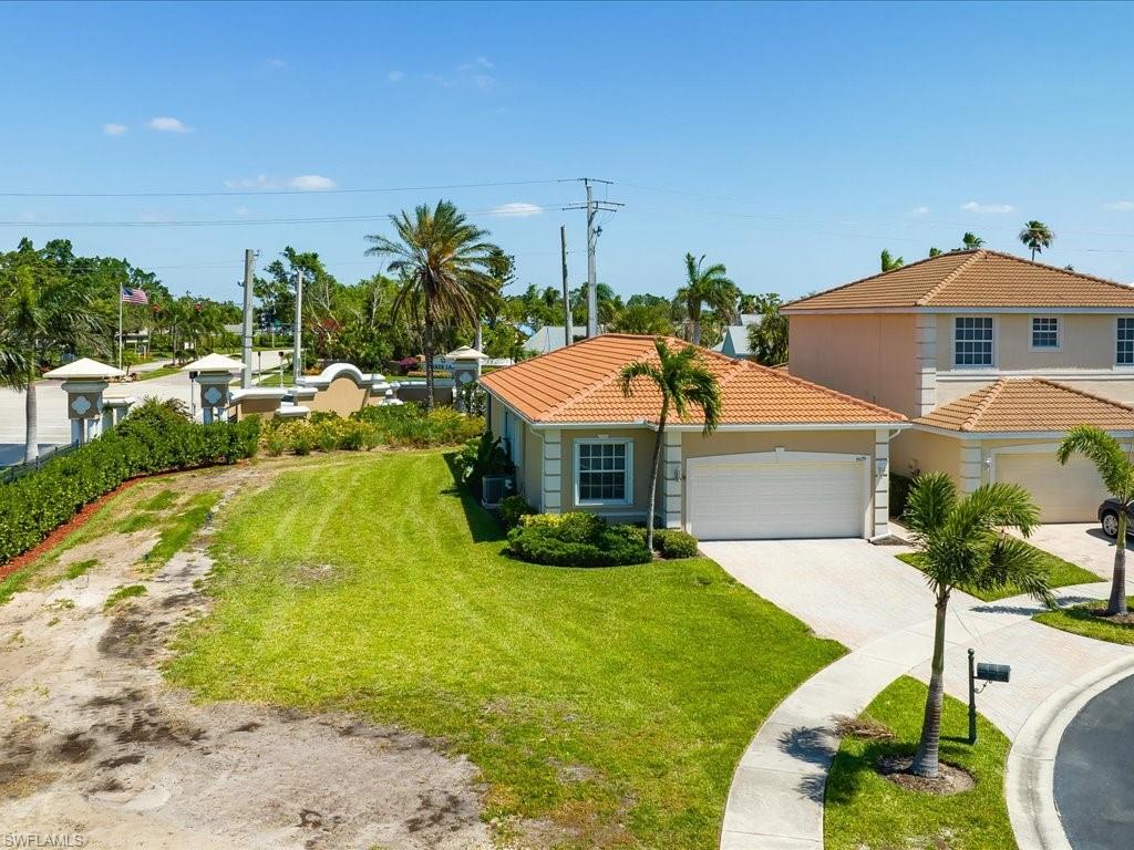 8679 Spring Mountain Way Fort Myers, FL 33908 - Photo 20 of 21 a view of a house with a garden