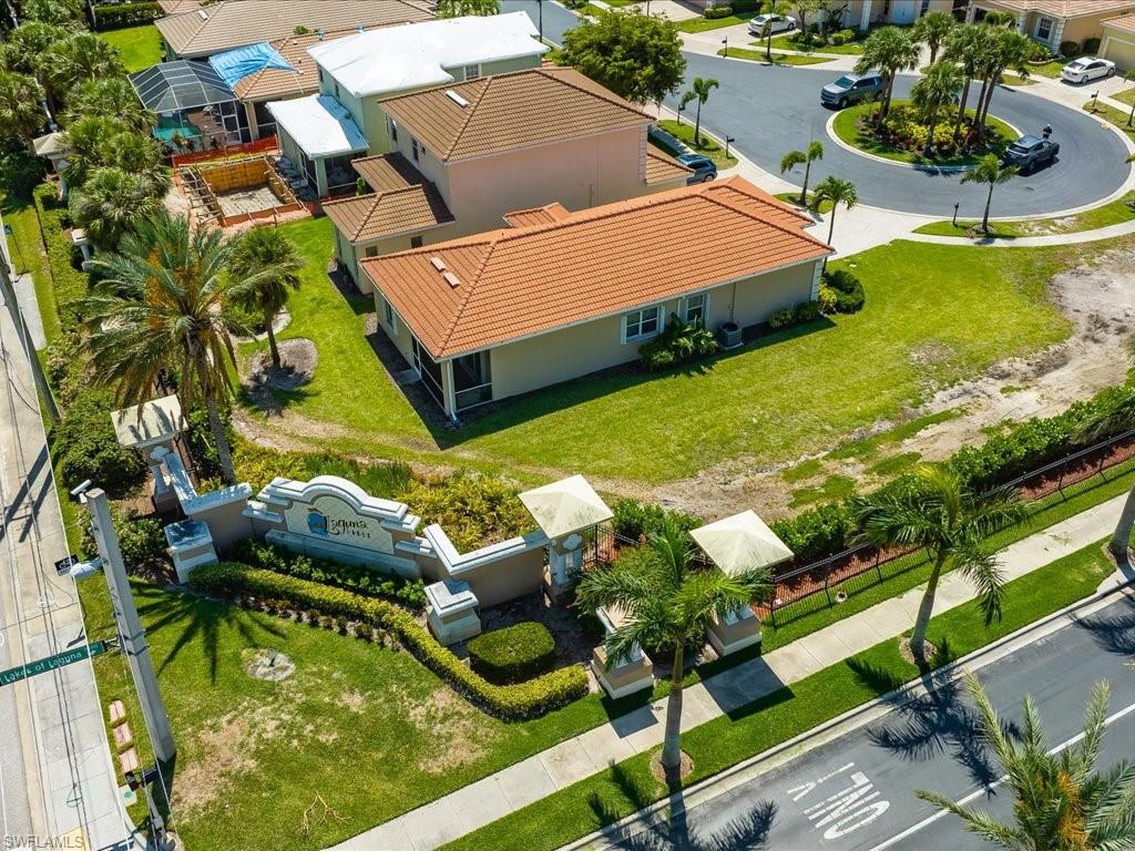 8679 Spring Mountain Way Fort Myers, FL 33908 - Photo 21 of 21 an aerial view of a house with swimming pool and outdoor seating