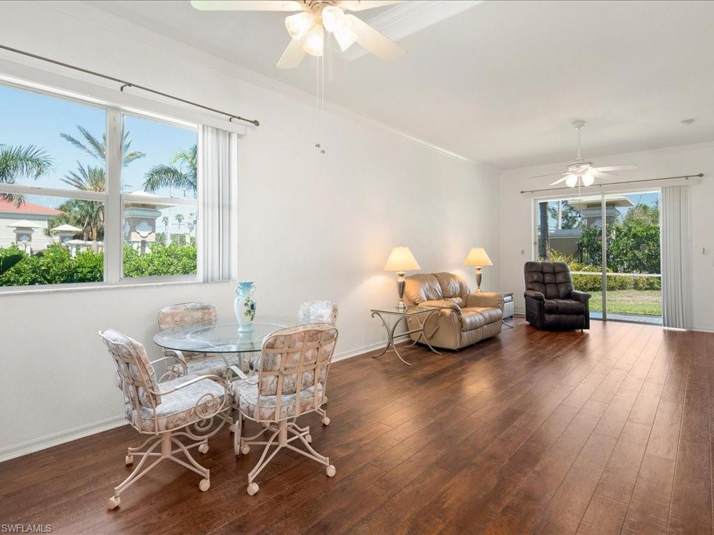 8679 Spring Mountain Way Fort Myers, FL 33908 - Photo 3 of 21 a living room with furniture and a large window