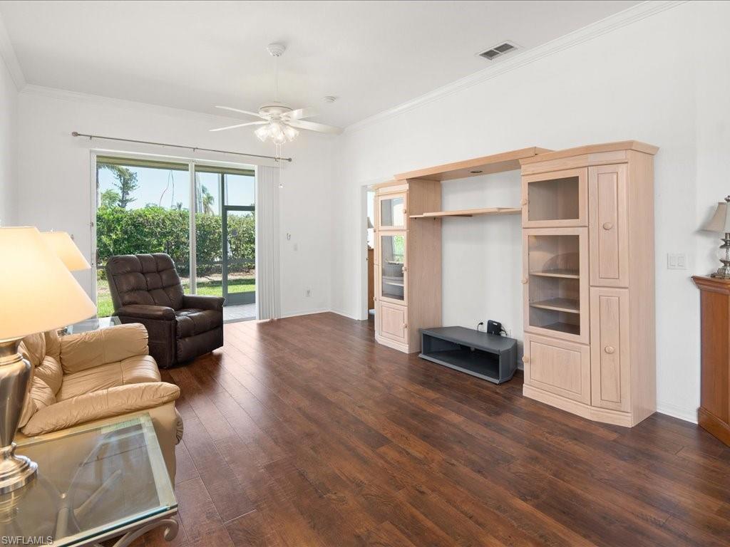 8679 Spring Mountain Way Fort Myers, FL 33908 - Photo 4 of 21 a living room with furniture and a large window