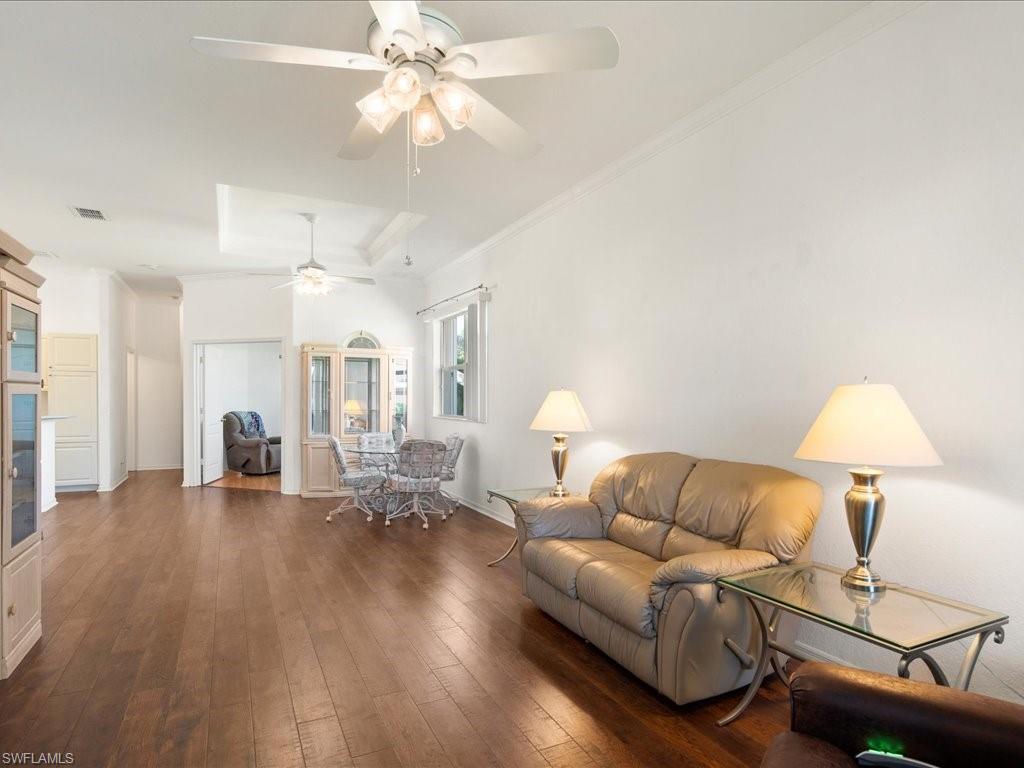 8679 Spring Mountain Way Fort Myers, FL 33908 - Photo 10 of 21 a living room with furniture and a wooden floor