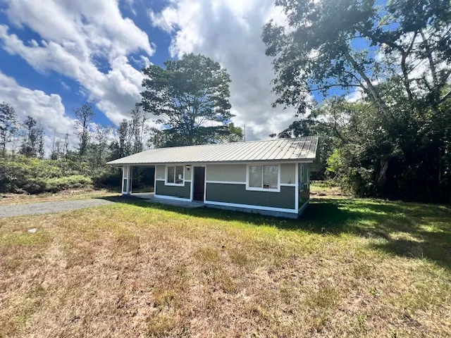 a house view with a garden space