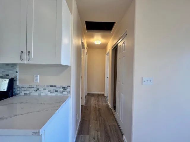 a view of a kitchen from the hallway