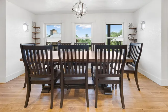 a kitchen with a sink and large wooden cabinets
