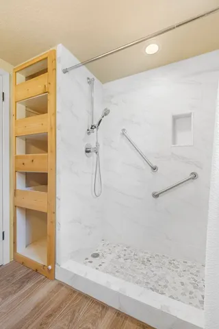 a living room with furniture fireplace and a window