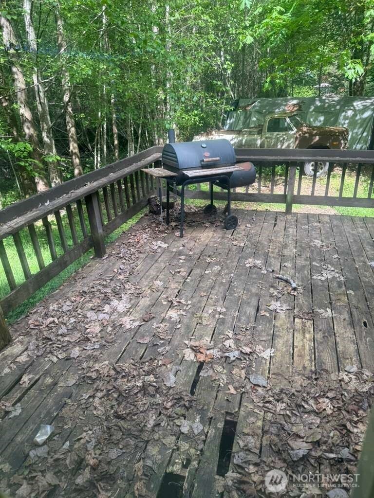 1671 Northeast Mission Creek Road Belfair, WA 98528 - Photo 13 of 31 a view of a bench in the backyard