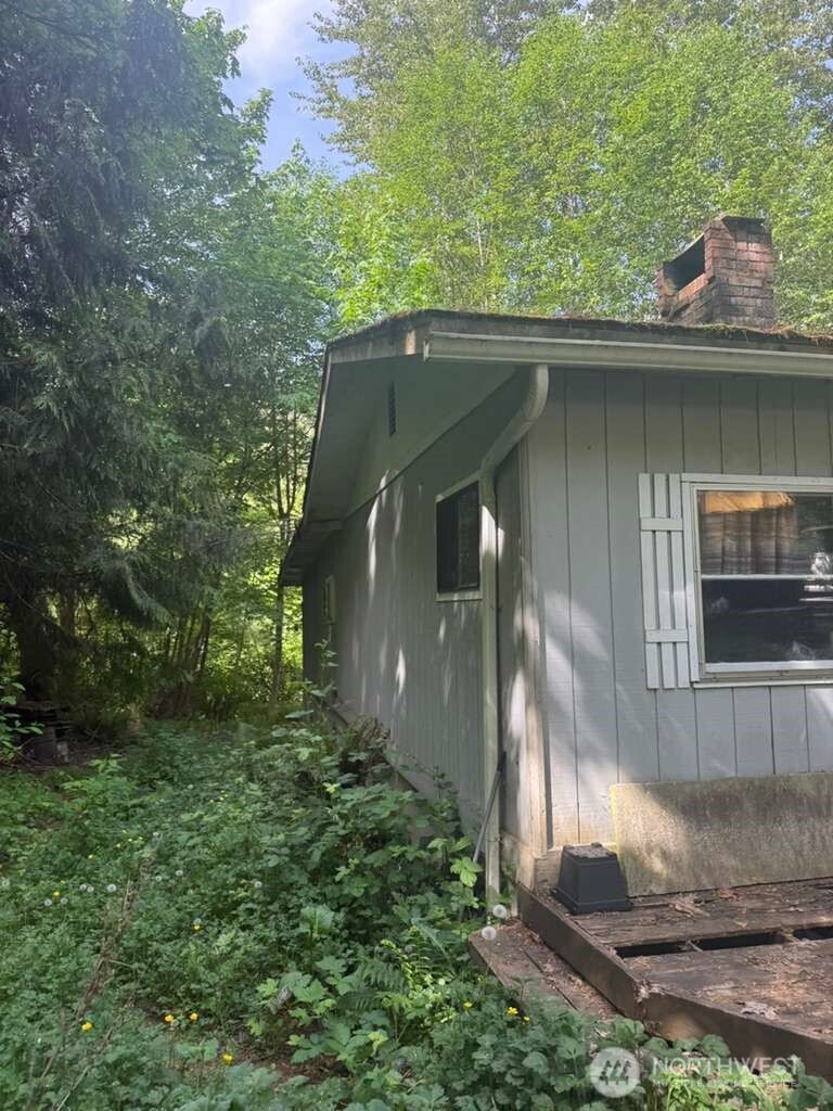1671 Northeast Mission Creek Road Belfair, WA 98528 - Photo 14 of 31 a backyard of a house with lots of green space