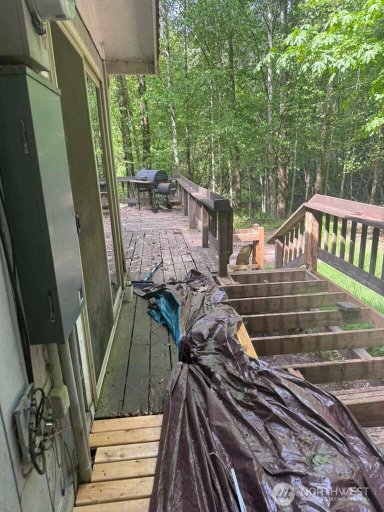 1671 Northeast Mission Creek Road Belfair, WA 98528 - Photo 23 of 31 a view of deck with wooden floor and outdoor seating