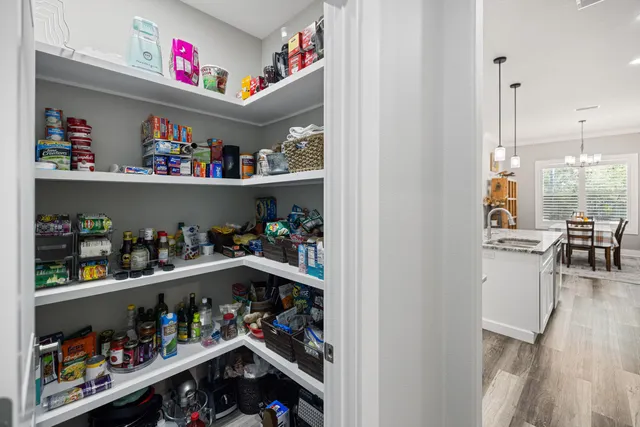 a kitchen with stainless steel appliances a stove sink microwave and cabinets