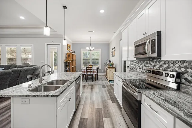 a dining room with furniture and a window