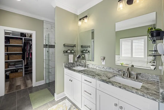 a white toilet sitting next to a bath tub and a shower