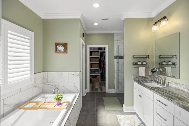 a bedroom with a bed and a television