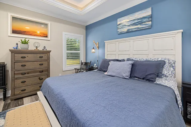 a spacious bedroom with a bed and a couch