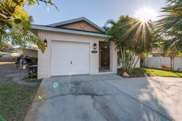 a view of a house with a yard and garage