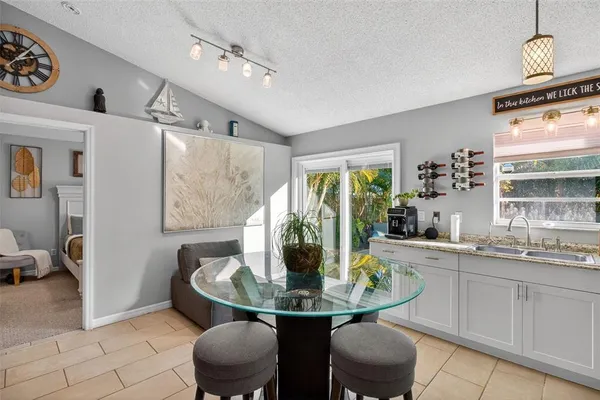 a dining room with furniture and window